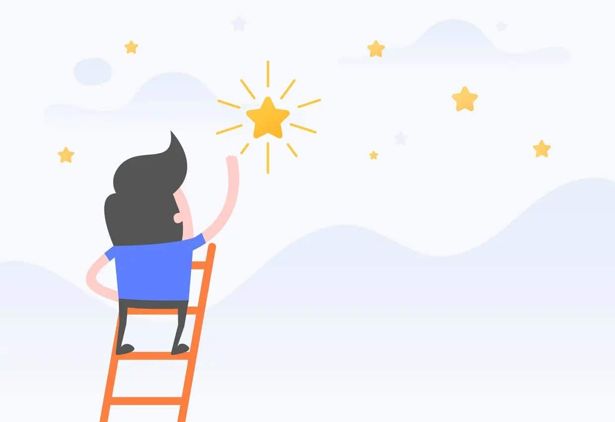 Social Media Manager ; Person, die nach einem Stern greift